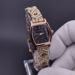 Handmade yellow braided strap watch featuring a vibrant, transparent orange bead centerpiece – a unique, artistic timepiece for daily wear.